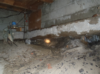 What you are looking at is a footing. Footings are supposed to be below the frost line in Michigan. There was over 45' feet of footing with no soil underneath. The house was literally hanging unsupported. The buyers on this one where young first time home buyers that where going to pass on the inspection and buy the home as is. Fortunately their mother talked them into getting a home inspection. They had no idea about the footing. Potential cost to fix this one would have been well over $10,000.00 dollars. The first time home buyers found a home shortly after this one and bought it as is with no inspection. I wish them the best.