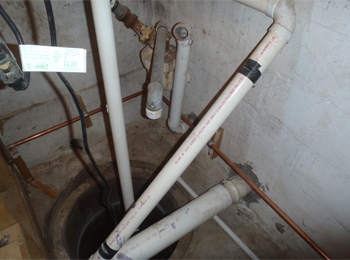 This one was advertised as "completley remodeled". It was a flip. Again this first time home buyer was going to wave his home inspection and by the house as is. The bank required him to get a Well/Septic evaluation. What you are looking at in this picture is sewer lines that where not connected to the septic system. The elbows over the sump pump and crock are there because the system backs up. The exceess raw sewage drops into the sump crock and discharged onto the lawn on the side of the home. It was evicent that the system had backed up on multiple occasions.